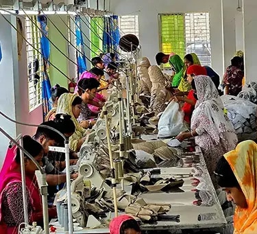 Operators working on the NR Caps BD sewing line