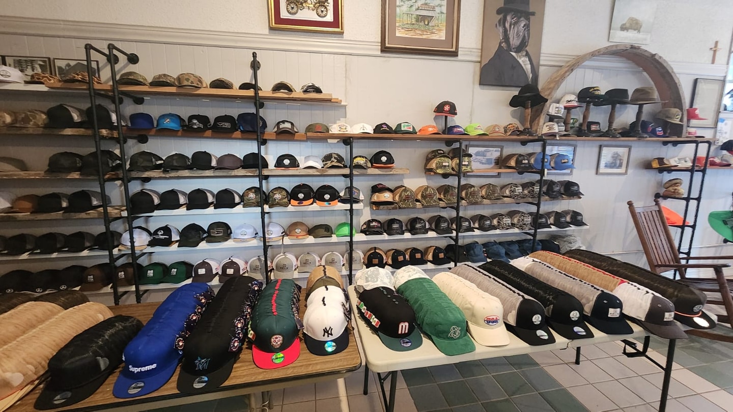 US Custom Caps showroom with cap samples on display